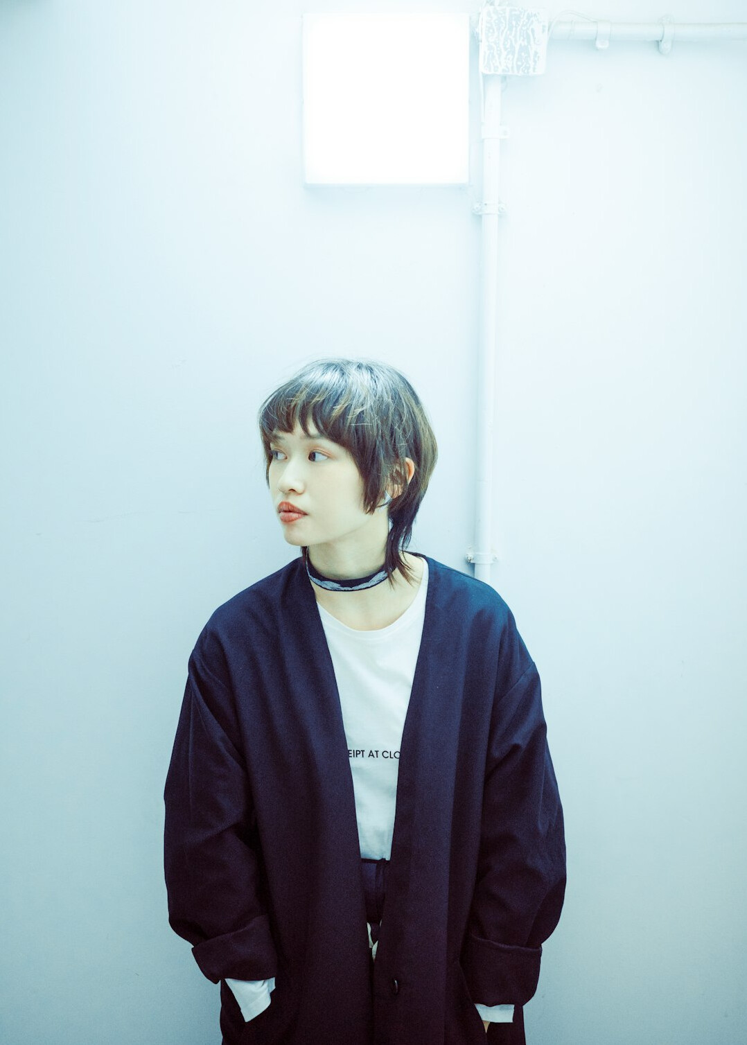 Studio portrait of a woman with short light brown hair and a blazer