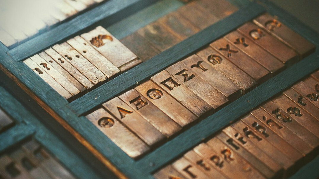 Stack of old archive documents and folders on a wooden table